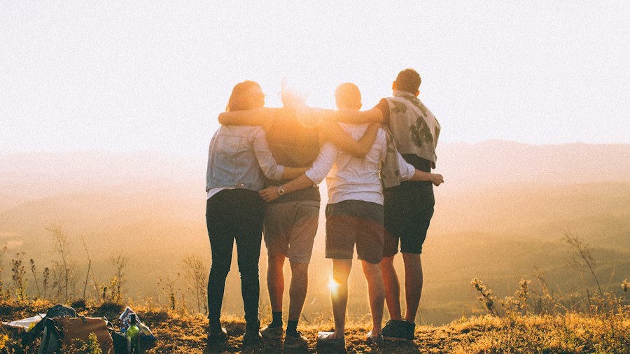 Friends standing together in an outdoor landscape