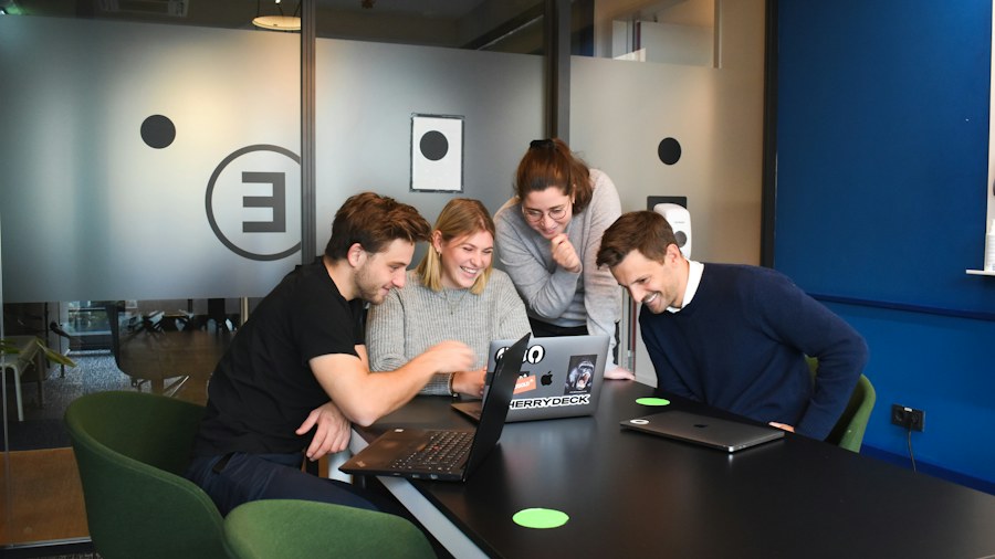 A team reviewing information together on a screen