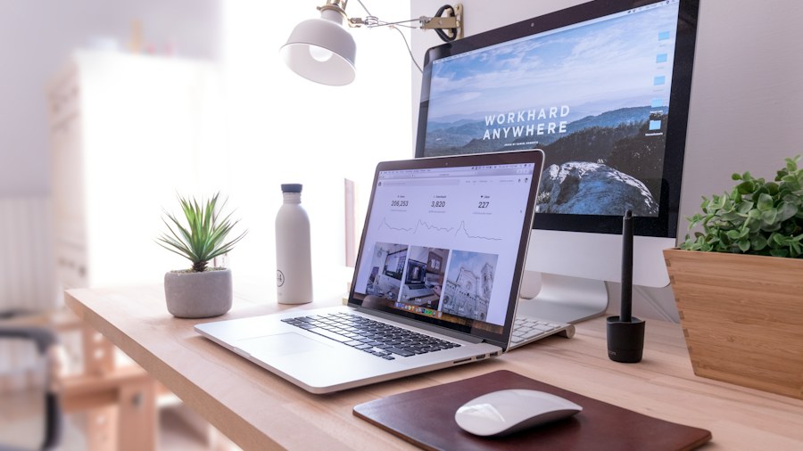 A home workspace with a laptop and monitor